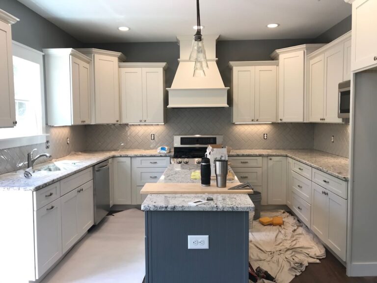 Handyman Services in Forsyth GA 31029, Tile installation. Picture of an open kitchen layout with center island. Herringbone tile backsplash.